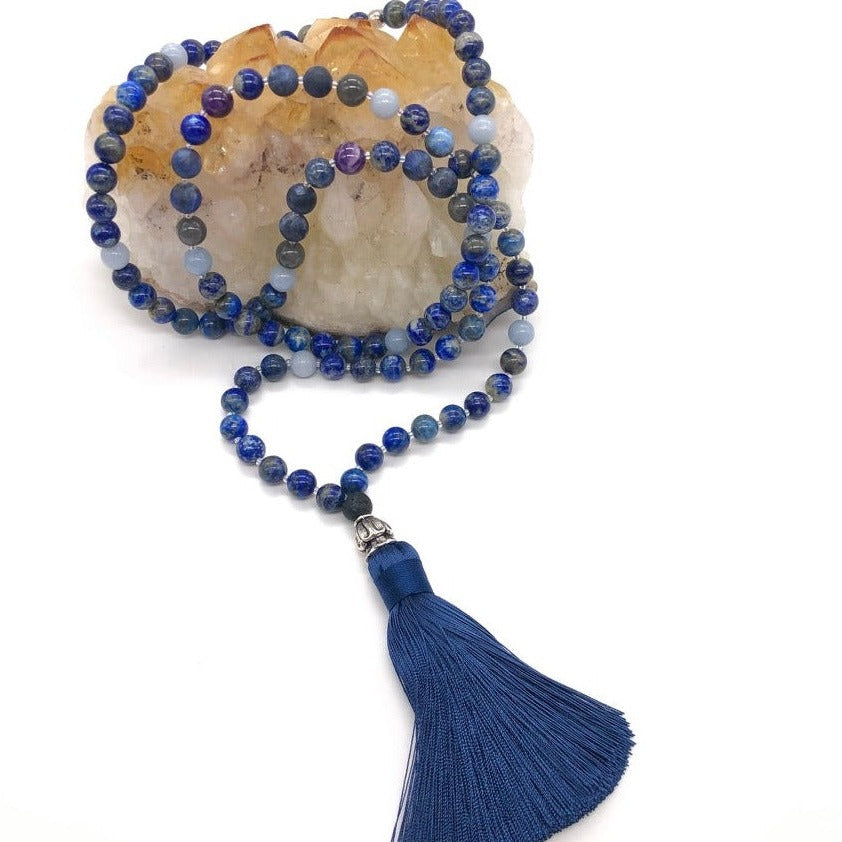 Third eye necklace made from lapis lazuli gemstones sits on top of citrine crystal