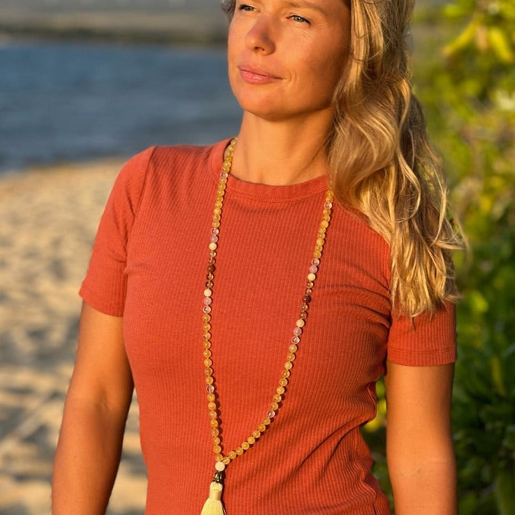 women wearing citrine crystal necklace 