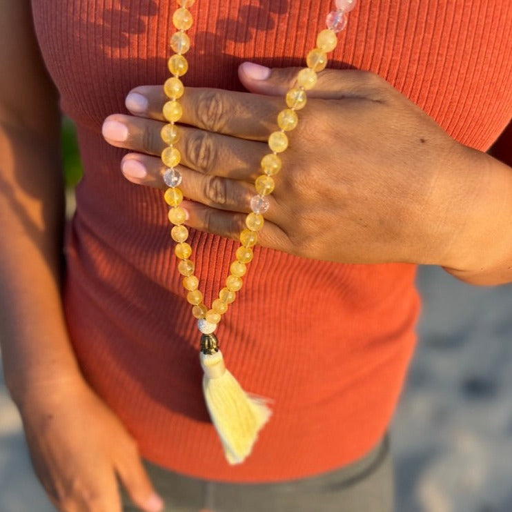 women wearing citrine crystal necklace with clear quartz and yellow tassel 